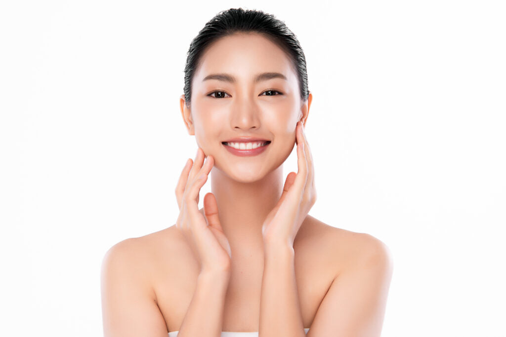 Beautiful young asian woman with clean fresh skin face care facial treatment cosmetology beauty and spa